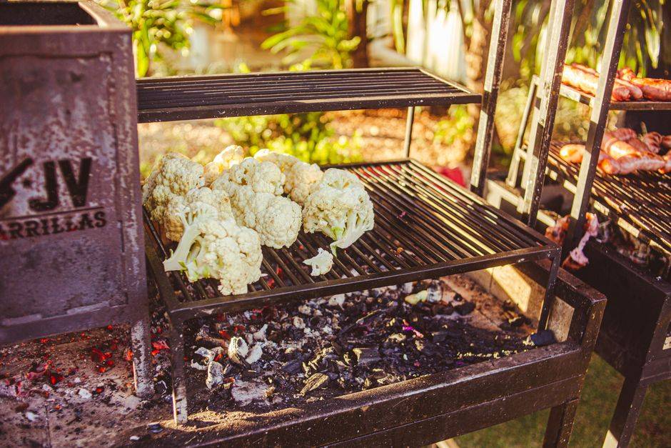 Healthy cauliflower grilling on an outdoor barbecue for a nutritious meal.